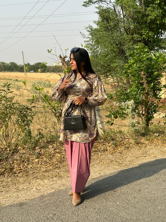Aman Tailor working on a garment